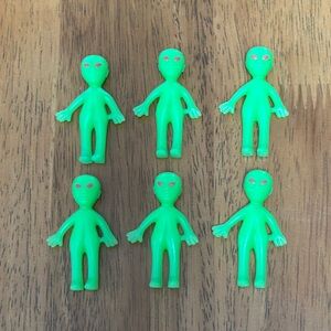6 green rubber alien figures. 2”. They can stand on their own.